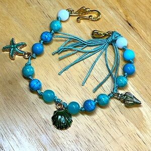 Green and turquoise beads with green seashell charms bracelet